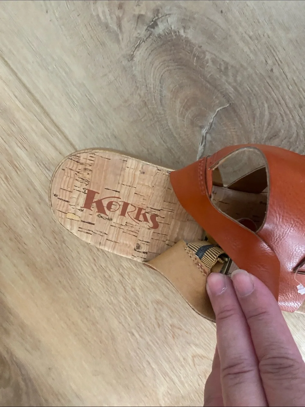 Women’s Korks platform wedge sandals feature a cork sole slingback buckle.